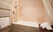 Broadgate House - bedroom four en-suite bathroom with bath and shower over, WC and basin
