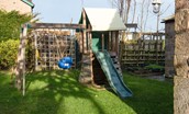 Castle View Cottage - children's playframe with swing and chute in the side garden