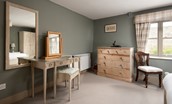 Bee Cottage - chest of drawers, dressing table with stool and large mirror in bedroom one