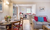 Barley Hill Cottage - open-plan living space with handmade Chalon-style kitchen and dining space for four guests