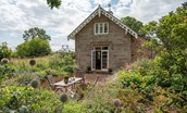 Rowchester West Lodge - leading out from the kitchen is a gravelled patio with an outdoor dining space