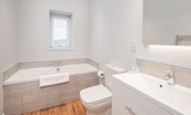 Byre - family bathroom with bath, walk-in shower, WC and basin