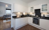 Chaffinch Cottage - contemporary monochrome kitchen adjacent to the sitting room