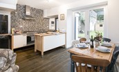 Chestnut Cottage - open-plan kitchen and dining area with French doors leading to the rear garden
