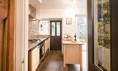 Chestnut Cottage - kitchen area with door leading into the utility room