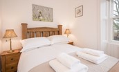 Chestnut Cottage - bedroom one with bedside tables and double bed