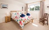 Coldstream Coach House - bedroom two with double bed and side tables