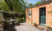 Daffodil Cottage - garden with garden furniture and stable door leading into the kitchen