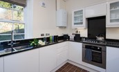 Dipper Cottage - kitchen area with monochrome colour scheme