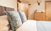 Hiddenhus - pretty floral scatter cushions dress the super king double bed