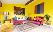 Lowtown Cottage - sun room filled with colour and artworks
