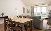 Hillside Cottage - wooden dining table with seating for four guests