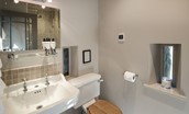 Williamston Barn & Cowshed - bedroom six en suite bathroom WC & basin