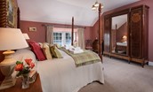 The Boathouse - bedroom two with four poster bed