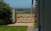 Overview Cottage - entrance gate and view towards Lindisfarne and the coast