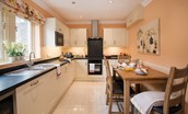 Dryburgh Stirling One - kitchen with plenty of storage and table seating four guests
