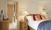 Dryburgh Stirling One - bedroom one with double bed and en suite bathroom