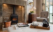 Beeswing - enjoy a fresh cup of coffee by the inglenook fireplace with electric stove in the sitting room - please note this was originally a wood burner as pictured, but this has now been changed to an electric stove for ease of use