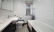 Calder Cottage - bathroom with WC, basin and bath with shower over