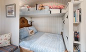 Cow Parsley - bedroom area with king size bed, single bunk bed above and a selection of books