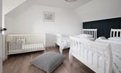 Sunwick Cottage - bedroom three with twin beds and full-size cot