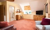 Dryburgh Farmhouse - bedroom two spacious sitting area with dressing table and flat screen tv