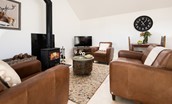 The Hemmel - enjoy a good film and a glass of wine by the wood burning stove - please note, furniture has been updated. New photographs pending - 1 fabric sofa and 1 leather armchair now provided.
