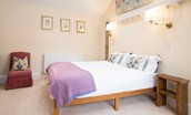 The Woodworker's Cottage - bedroom three with king size bed, bedside tables and single chair
