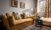 Old Purves Hall - second floor sitting room with large double sofa and sheep skin bean bags