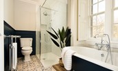 Cairnbank House - bedroom one en suite bathroom with roll top bath and large walk in shower