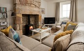 Peep-O-Sea Cottage - cosy living area with inglenook fireplace and gas log burner