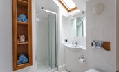 Sea Breeze - en-suite shower room with shower, WC and basin with mirror above