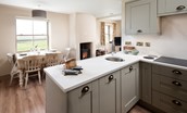 Bee Cottage - well-equipped kitchen and dining area with sitting room beyond