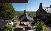 Marine House Cottage - garden furniture on the upper terrace, the perfect spot for a meal or a glass of wine whilst taking in the views