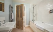 Crailing Cottage - bath with shower overhead