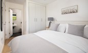 3 The Bay, Coldingham - bedroom one with king size bed and full-length built-in wardrobes