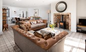Number Nine, Lanchester - the convivial open plan living area with gas fired woodburner