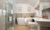 Cuthbert House - family bathroom with large bath with handheld shower attachment