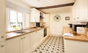 The School House, Capheaton - the kitchen with Victorian-inspired star tiled floor