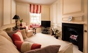 Eslington East Wing - first floor sitting room with comfortable seating and TV