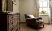 Old Granary House - armchair and large chest of drawers in bedroom two