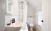 West Mill Cottage - the family bathroom features a bath with shower over
