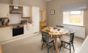 The Rushes - spacious kitchen with dining space for four guests