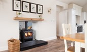 Riverhill Cottage - double-sided wood burning stove in the open dining and living area