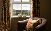 Old Granary House - armchair in bedroom one to sit back and enjoy the wonderful views of rolling Northumbrian countryside