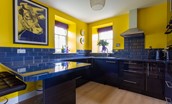 Lowtown Cottage - kitchen with sleek blue integrated cabinets