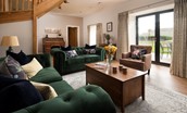 Granary View, Brockmill Farm - sitting room with plenty of comfortable seating and large French doors leading out to the garden