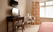 Greengate - dressing table, occasional chair and TV in bedroom one