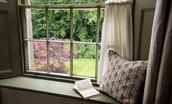 Stable Cottage, Glanton Pyke - first floor window seat with views over the pretty garden