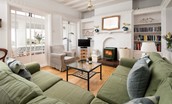 The Tumblers - bright sitting room with comfortable corner sofa and armchair